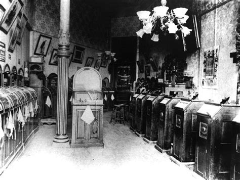 A phonograph/kinetoscope parlor in San Francisco, 1895. The nickelodeon machines on the left ...