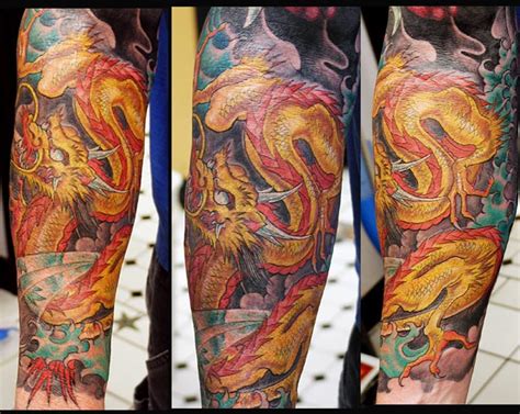 Gold dragon by Joe Capobianco: TattooNOW