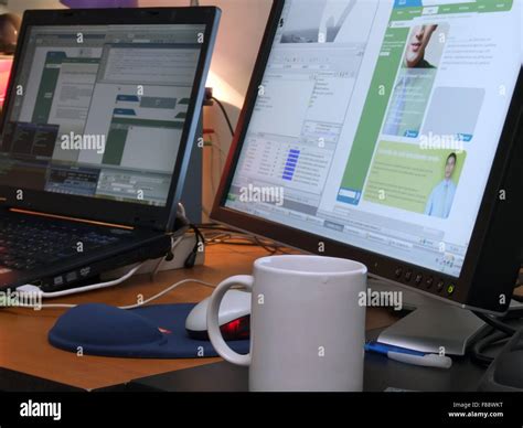 laptop and big wide screen closeup Stock Photo - Alamy