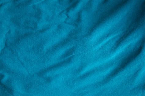 Blue fabric folds texture of natural weave cloth dark teal color fabric natural cotton or linen ...