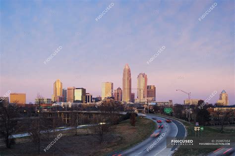 Charlotte skyline at sunrise and skyscrapers in downtown of city, USA ...