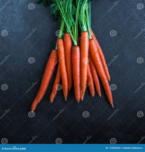 A Bunch of Carrots. Fresh Raw Carrots with Stems Stock Photo - Image of ...