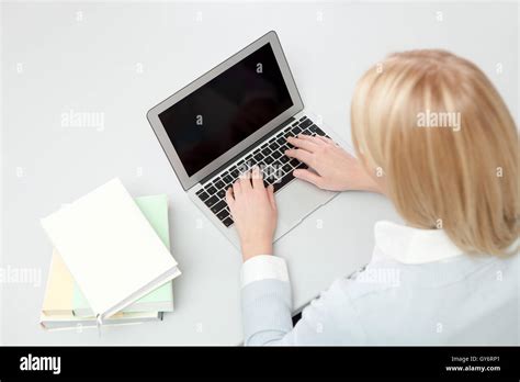 Beautiful student girl studying with laptop Stock Photo - Alamy