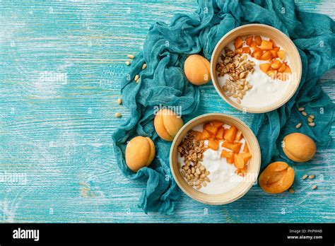 Homemade yogurt with granola, apricot and pine nuts Stock Photo - Alamy