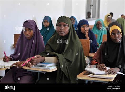 Somali students listen to their teacher in the class at the Somali ...