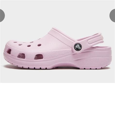 light pink crocs love these they are so cute for... - Depop