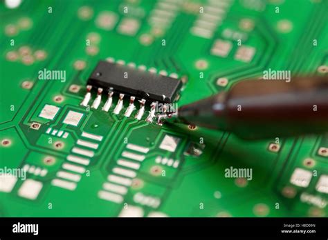 Soldering an electronic component on a printed circuit board Stock Photo - Alamy