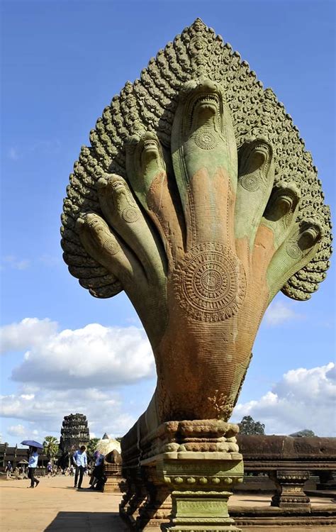 The 7-headed Naga at the entrance of the Angkor Wat Temple I Cambodia. Built by the Hindu King ...