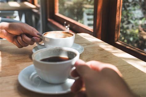 Two People Holding and Drinking Coffee in the Morning Stock Photo ...