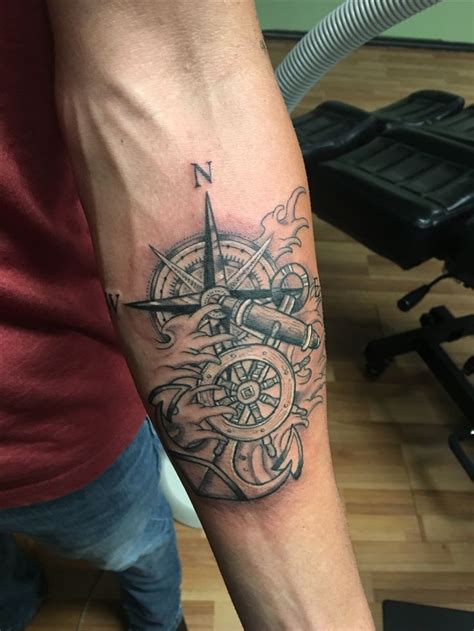 Ship wheel, compass, anchor | Tattoos for guys, Hand tattoos, Rose ...