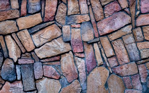 Stone wall background in vector. The wall is made of multi-colored ...