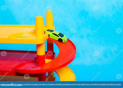 Game for Small Boys Car Parking on a Blue Background . Game for Boys . Plastic Games Stock Photo ...