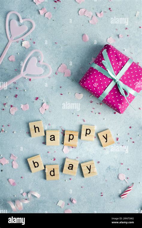 Flat lay happy birthday wish wooden letters present Stock Photo - Alamy