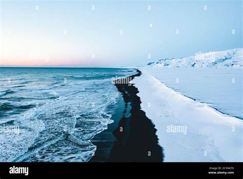 Overhead Aerial Shot of Beautiful Black Beach in Iceland in Winter with ...