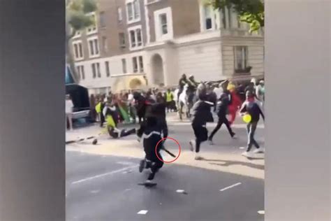 Notting Hill Carnival stabbings: Shocking moment teenage yobs run away 'wielding huge machetes'