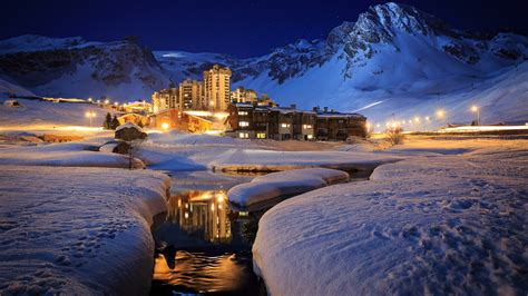 Luxury ski resort at night in Tignes, France wallpaper - backiee