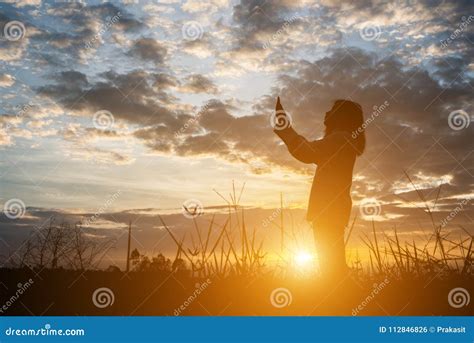 Silhouette of Women Pray during Sunset. Stock Photo - Image of peace, silhoutte: 112846826