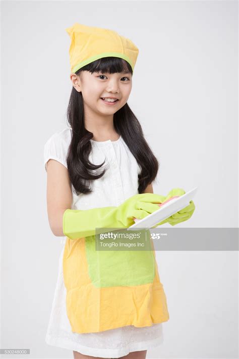 Stock Photo : A girl wearing a cleaning outfit and cleaning in 2020 | Girls wear, How to wear ...