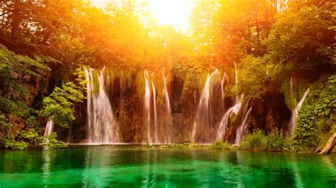 Serene Waterfall: A Vibrant HD Wallpaper of Nature's Beauty