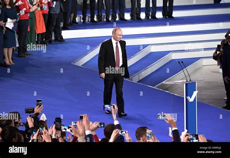 Russian President Vladimir Putin walks on to stage to address the All ...