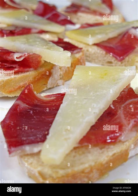 Spanish style tapa of sliced Jamon Iberico de Bellota and Manchego ...