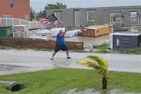 Florida man waves American flag in Hurricane Ian's face