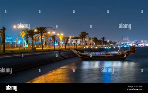 Doha, Qatar- May 05,2022:View of qatar Corniche during night with a colorful decorated ...