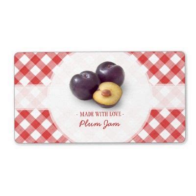 two plums on a checkered table cloth with the words make with love ...