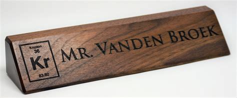 THESE 10 INCH DESK NAME PLATES ARE MADE FROM SOLID WALNUT WOOD. THEY ARE LASER ENGRAVED WITH THE ...