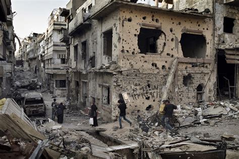 City of Devastation: Syrians return to Hellish Scenes in Homs | Time