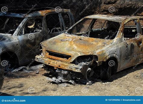 Two rusty burned out cars stock photo. Image of explosion - 107395056