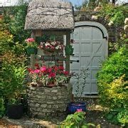 Wishing well with beautiful flowers. | Cottage garden, Planter pots outdoor, Lawn and landscape