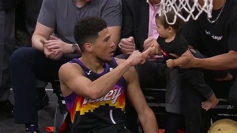 Devin Booker daps up baby in viral moment during Game 2