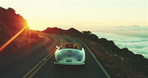 Happy Couple Driving On Country Road Into The Sunset In Classic Vintage Sports Car Stock Footage ...