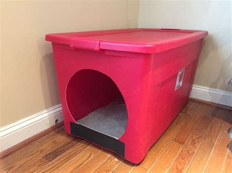 Homemade litter box from a large storage container. Made for our large cat that had problems ...