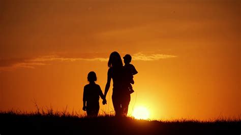 Mother Two Kids Silhouettes At Sunset Stock Footage SBV-323589893 ...