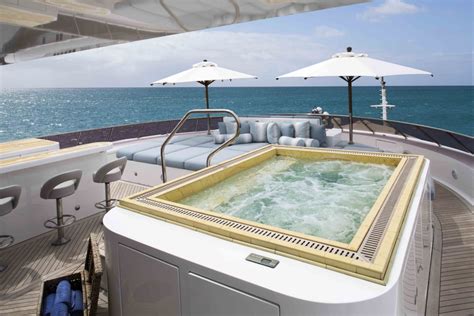 Luxury yacht UNBRIDLED - Sundeck Jacuzzi, sunpads and bar — Yacht Charter & Superyacht News