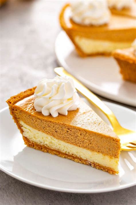 A slice of Pumpkin Pie Cheesecake with whip cream on a white plate. | Easy pumpkin pie, Pumpkin ...