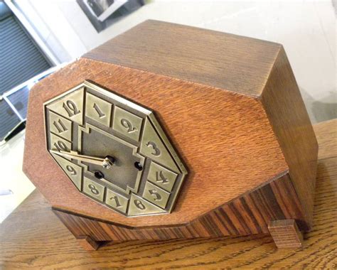 Striking Art Deco Mantle Clock with Mixed Wood and Brass Detail For Sale at 1stDibs