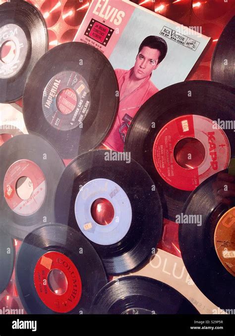 Vintage vinyl records and a record sleeve with Elvis Presley‘s picture ...