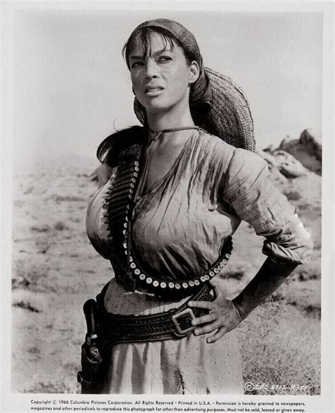 an old photo of a woman in the desert