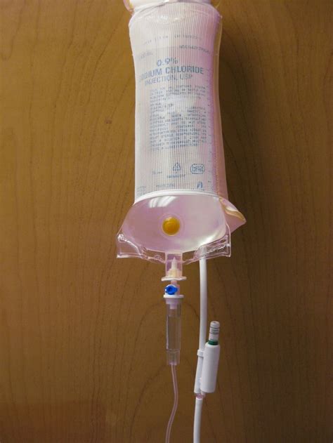 Figure 3. A pressure bag, saline bag, IV line and needle create the ideal lavage system ...