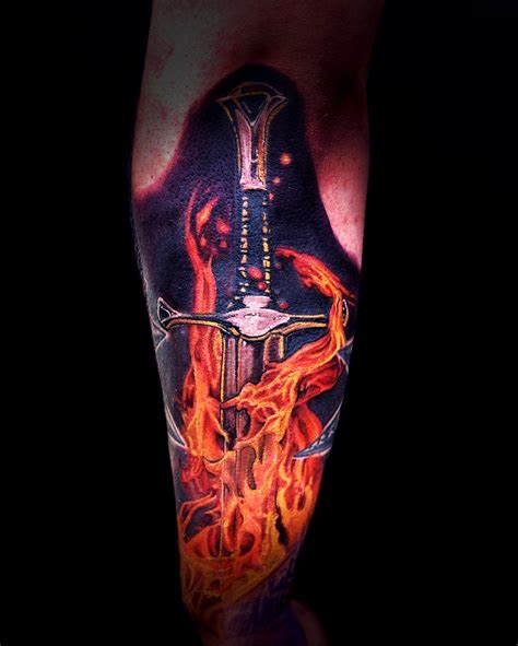 Sword in the flames tattoo i got last year by Marc Robertson : r/SWORDS