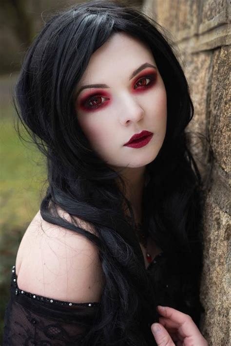 Absolutely love this makeup and the red contacts. Total vamp ...