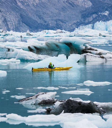 Kayaking in a glacial lagoon in the Muir Inlet of Glacier Bay ...