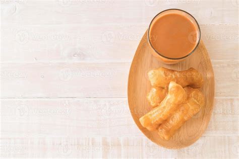 Deep-fried dough stick with milk tea on wood 3109022 Stock Photo at ...