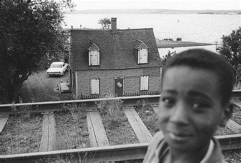 Boy in the foreground before the demolition of Africville and the relocation of residents ...