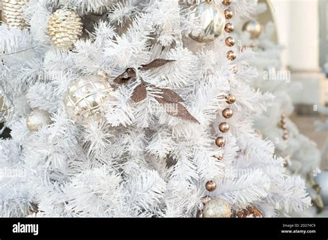 Christmas decoration, white Christmas tree with gold ornaments, leaf ...