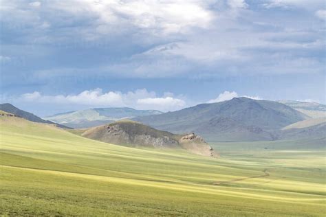 Landscape of the green Mongolian steppe under a gloomy sky, Ovorkhangai province, Mongolia ...