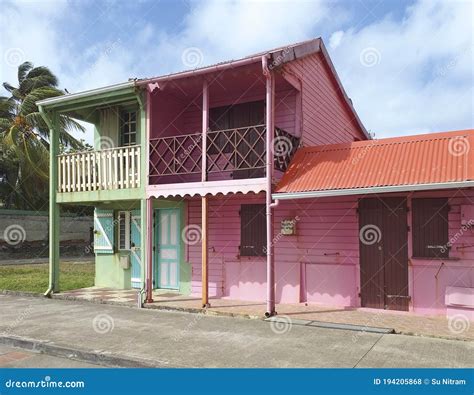 Colorful Traditional Caribbean Houses with Pink and Green Facades ...